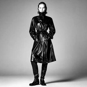 Steven Meisel / Zara shiny black faux patent leather knee-length trench coat.